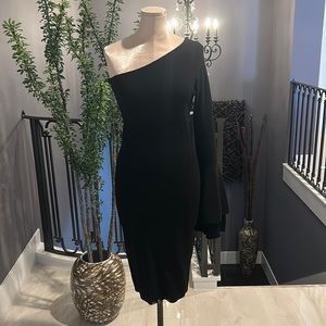 Asymmetrical knit dress very flattering with beautiful arm design